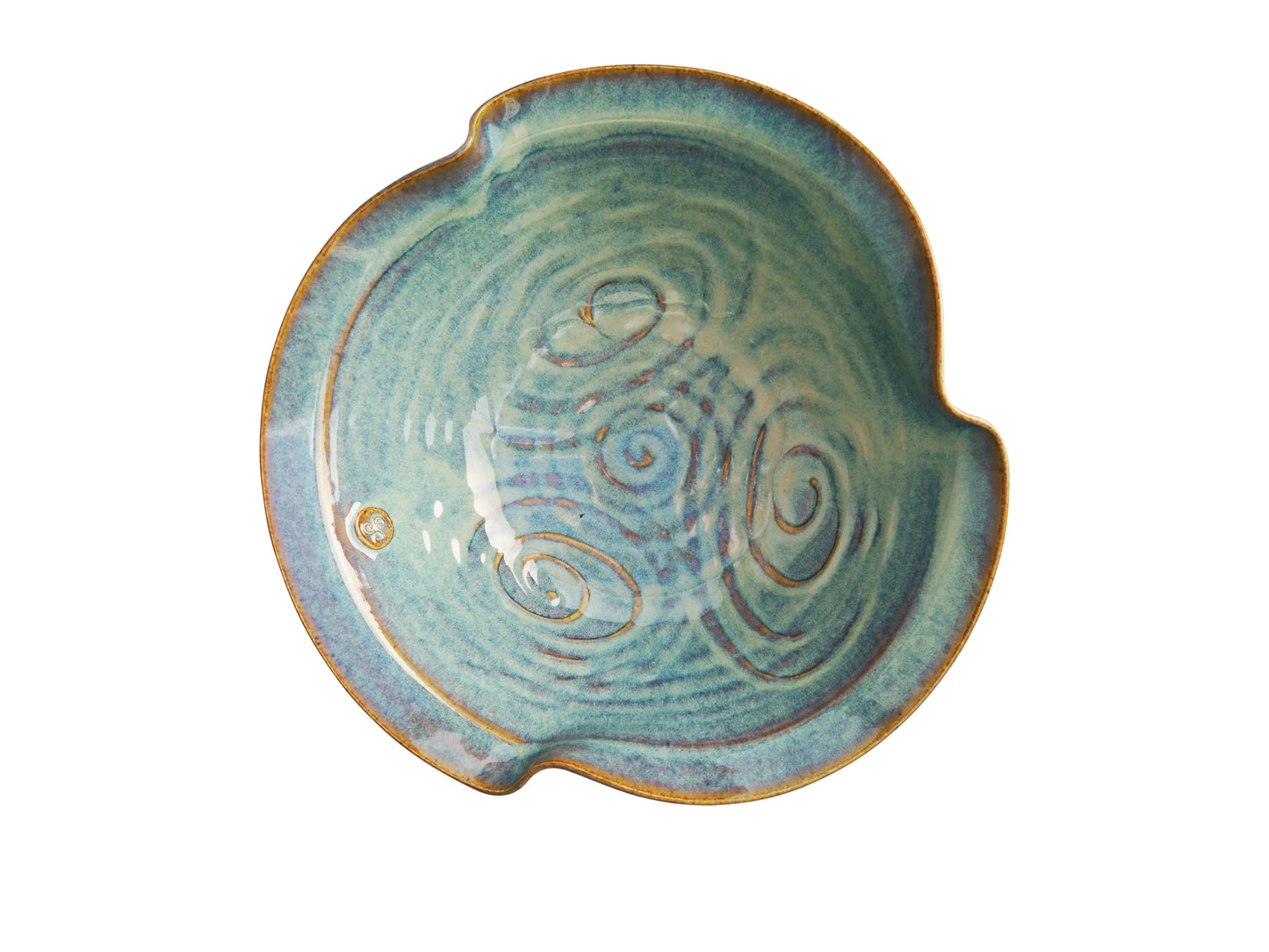Handcrafted blue ceramic pottery bowl with spiral designs and a small emblem, Kilkenny heritage