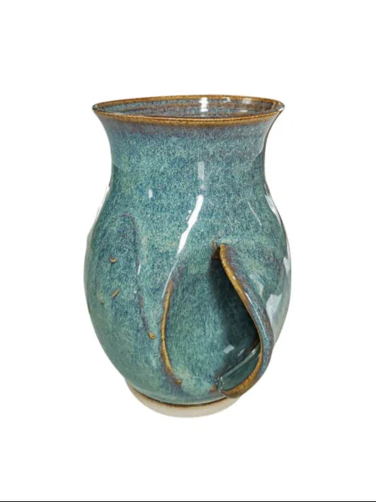 Green ceramic handwarmer mug with thumb cutout, handcrafted Kilkenny pottery with glazed finish