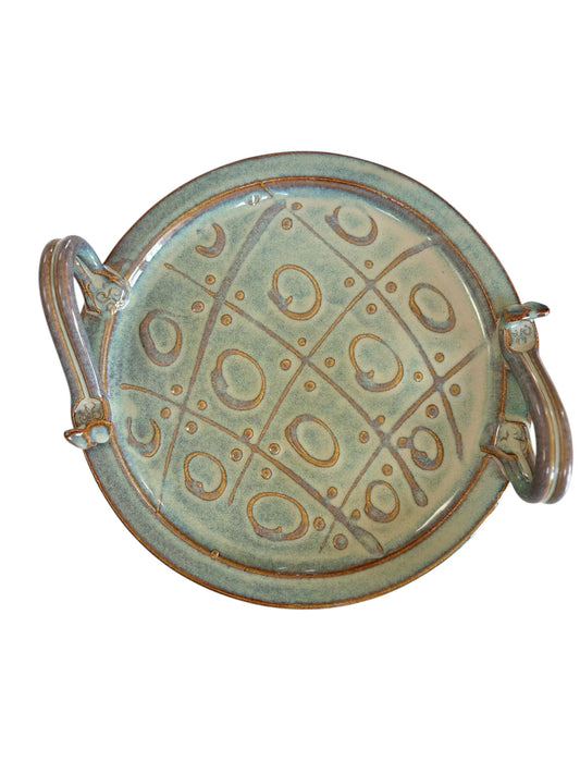 Handcrafted large green pottery serving plate with circular patterns and dual handles by Castle Arch Pottery