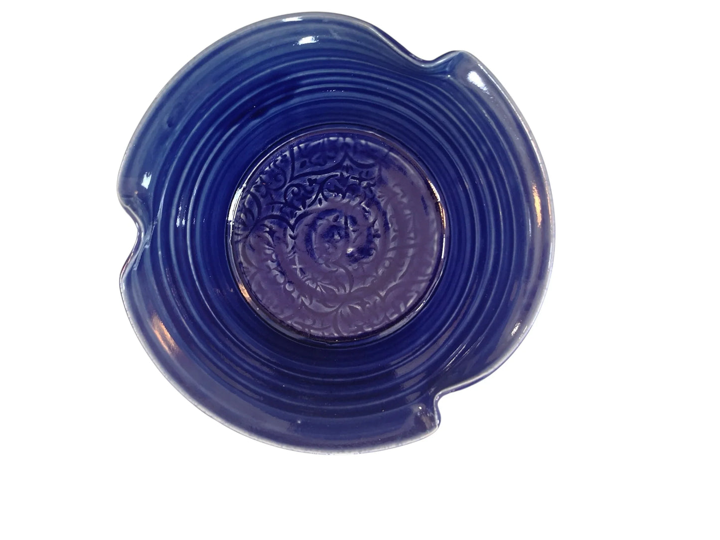 Handcrafted deep blue ceramic pottery plate with embossed central design from Kilkenny