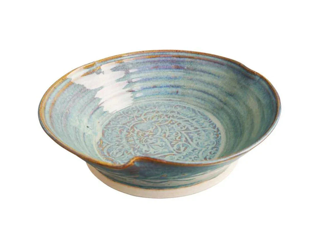 Handcrafted ceramic salad bowl with intricate blue glaze and embossed design from Kilkenny pottery