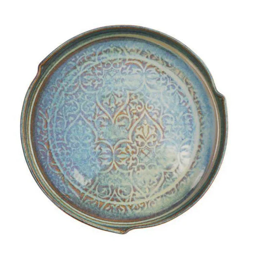 Round green ceramic serving dish with intricate textured pattern, handcrafted Kilkenny pottery