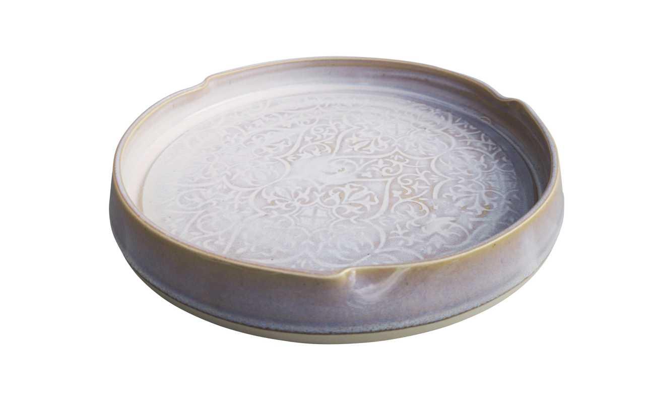 White serving dish with wavy edge and pattern made by castle arch pottery