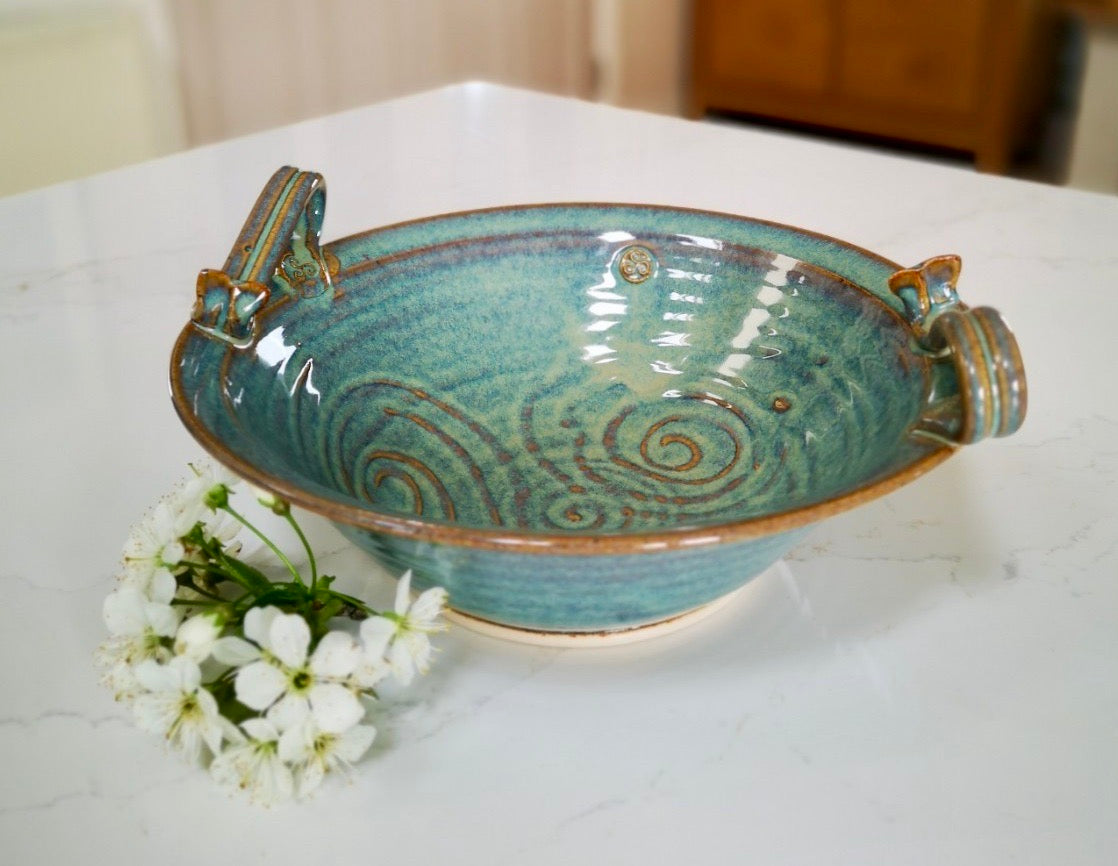 Green Salad Bowl with Handle decorated with Newgrange trickle made by Castle Arch Pottery