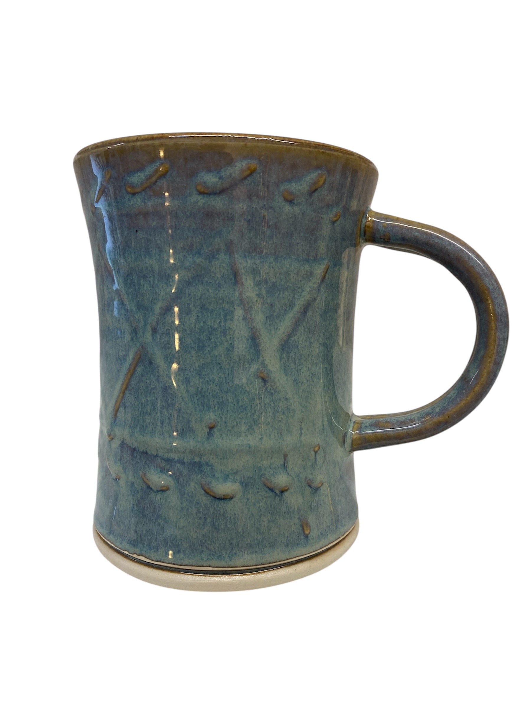 Experience the warmth of traditional craftsmanship with our Oilean Tankard Mug, lovingly handmade in Kilkenny. Expertly thrown on the potter’s wheel, each mug showcases the artisan’s signature glaze, creating a unique and beautiful finish that reflects the heritage of Irish pottery. Designed with a gently cylindrical shape, this mug is as comfortable to hold as it is delightful to drink from, providing a secure grip that feels like a warm hug on a chilly day.


